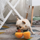 Dog playing with pineapple plush toy interactive dog toy for fun and enrichment